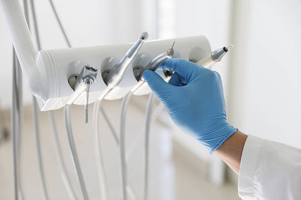 Professional Tooth Extraction technician working in Fort Bliss, TX